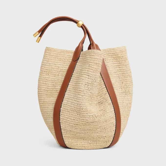 Stor Drop Bucket-väska i raffia och kalvskinn Stor Drop Bucket-väska i raffia och kalvskinn