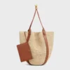 Stor Drop Bucket-väska i raffia och kalvskinn Stor Drop Bucket-väska i raffia och kalvskinn