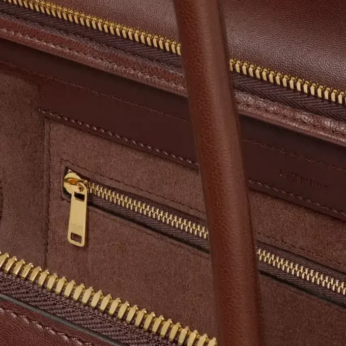 Stort luggage i mjukt, glansigt lammskinn