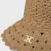 Triomphe-hatt i genombrutet raffia