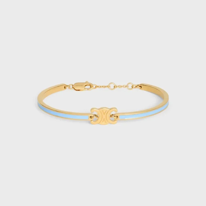 Triomphe ledat armband i emalj och mässing med guldfinish