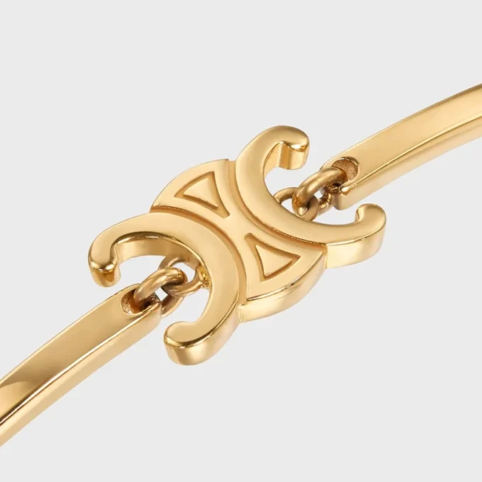 Triomphe ledat armband i mässing med guldfinish
