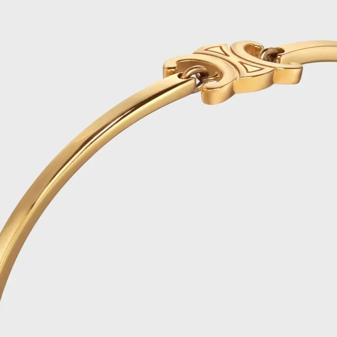 Triomphe ledat armband i mässing med guldfinish