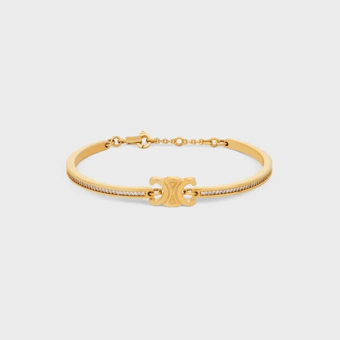Triomphe ledat glittrande armband i strass och mässing med guldfinish