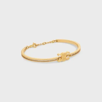 Triomphe ledat glittrande armband i strass och mässing med guldfinish