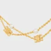 Triomphe Pearl dubbelhalsband i mässing med guldfinish och pärlor av harts Triomphe Pearl dubbelhalsband i mässing med guldfinish och pärlor av harts