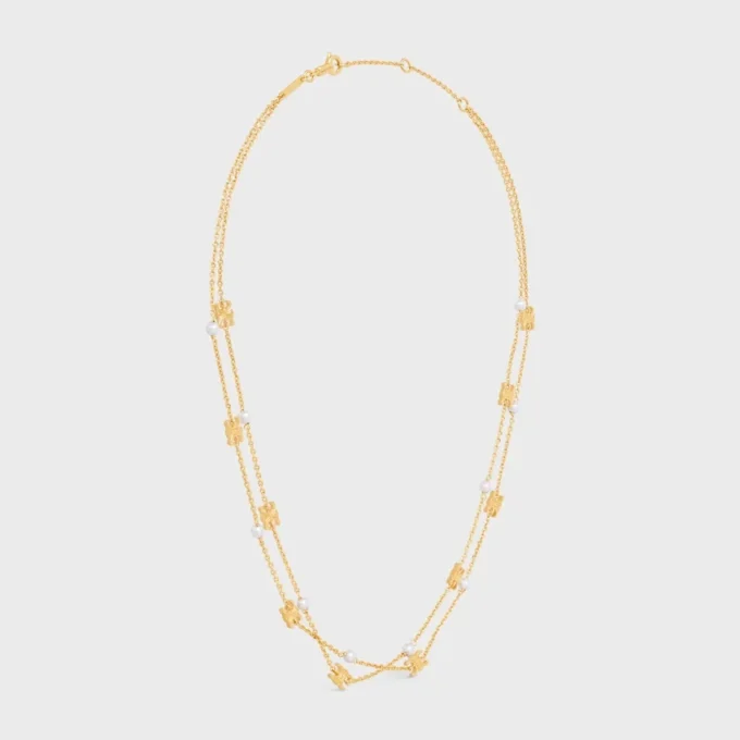 Triomphe Pearl dubbelhalsband i mässing med guldfinish och pärlor av harts Triomphe Pearl dubbelhalsband i mässing med guldfinish och pärlor av harts