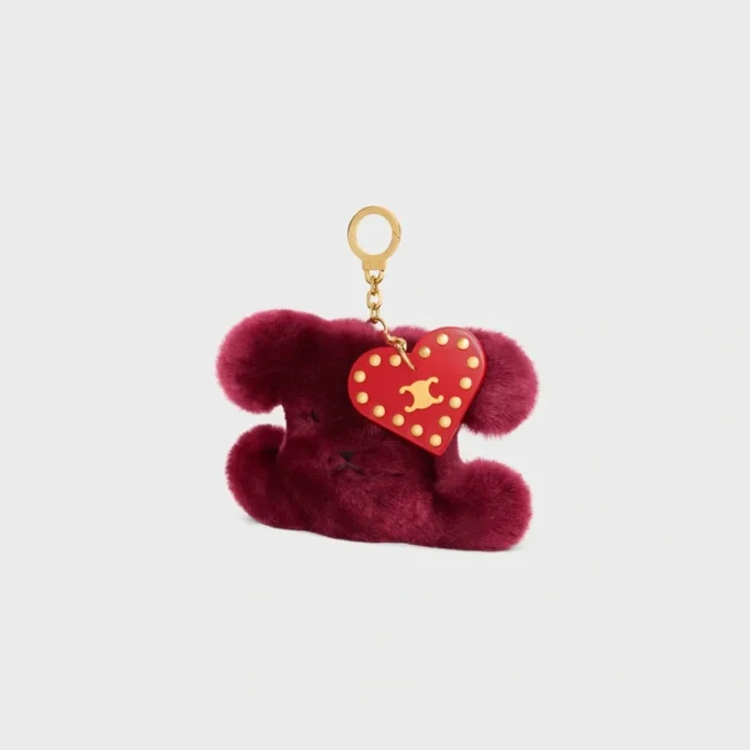 Triomphe Pom-Pom-berlock i broderat fårskinn och kalvskinn Triomphe Pom-Pom-berlock i broderat fårskinn och kalvskinn