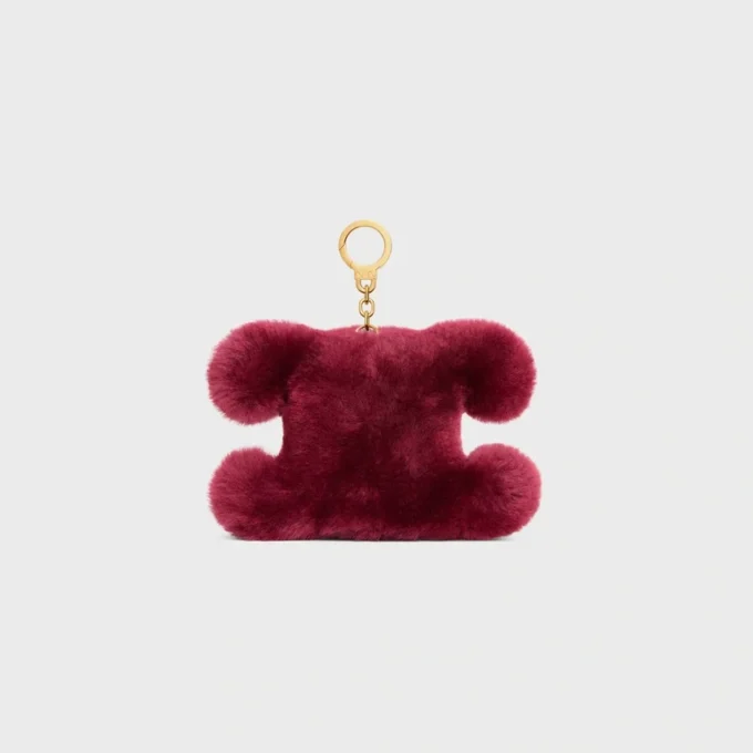 Triomphe Pom-Pom-berlock i broderat fårskinn och kalvskinn Triomphe Pom-Pom-berlock i broderat fårskinn och kalvskinn