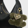 Triomphe Pom-Pom-berlock i fårskinn och kalvskinn Triomphe Pom-Pom-berlock i fårskinn och kalvskinn